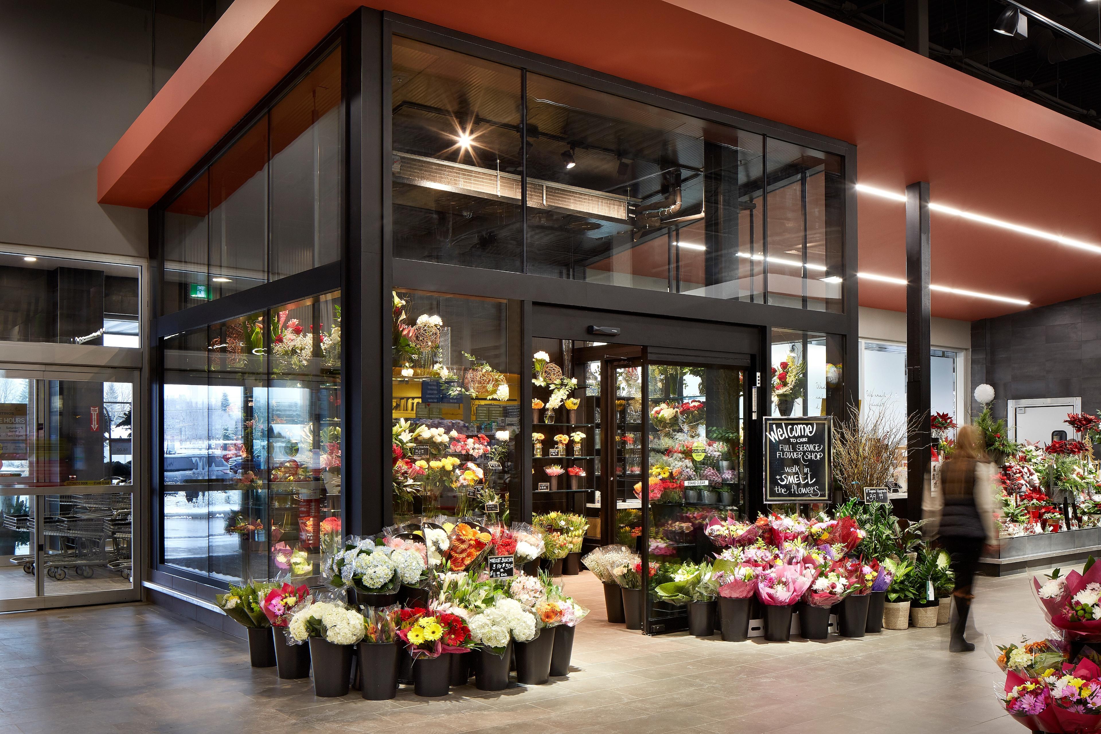 The Flowers by Fortinos floral counter surrounded by dozens of bouquets and floral arrangements.