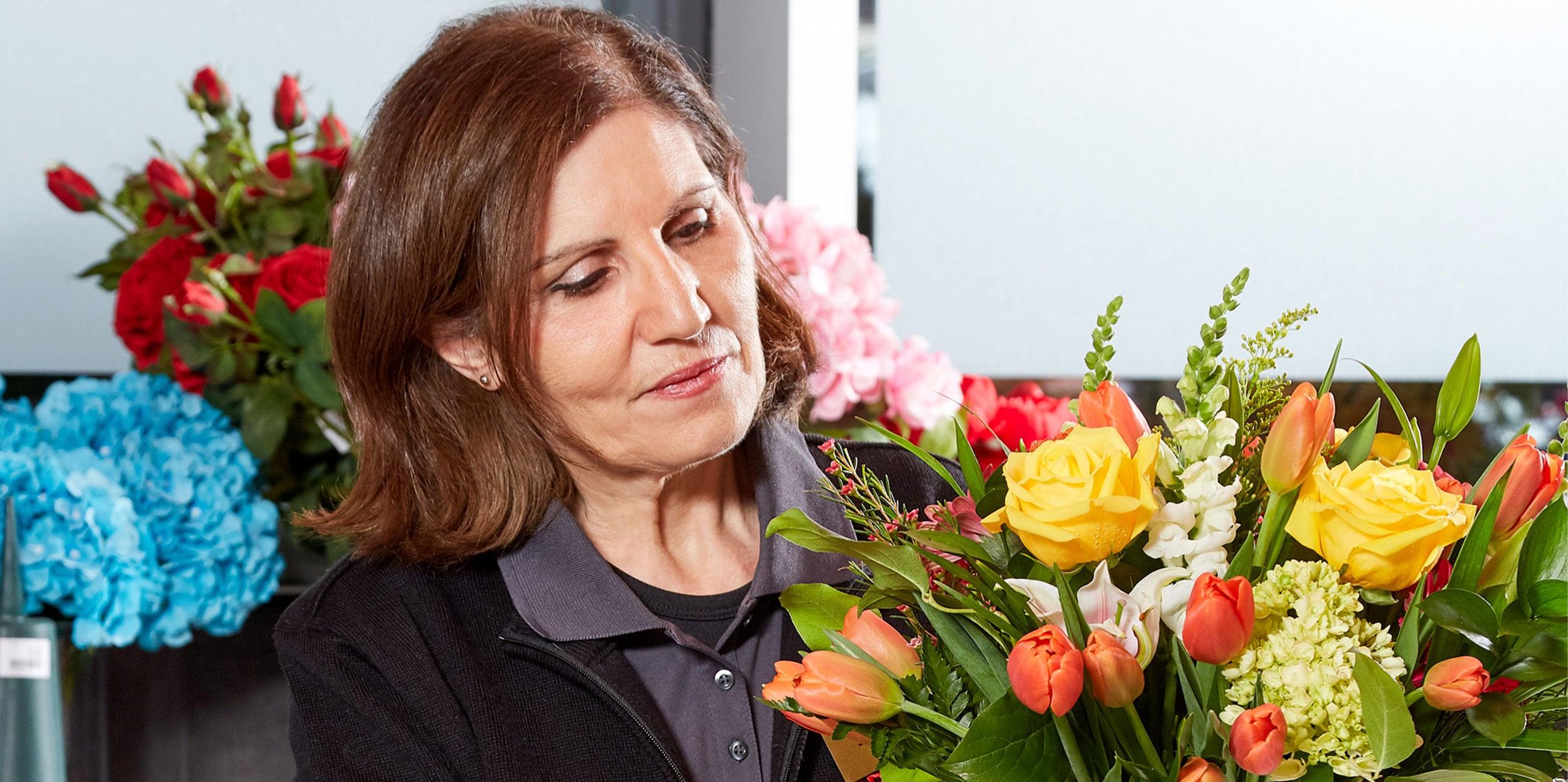 A Flowers by Fortinos floral designer arranges a beautiful bouquet of flowers.